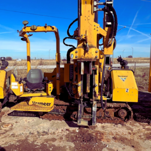 Vermeer pile driver prepared for solar foundation installation on a construction site